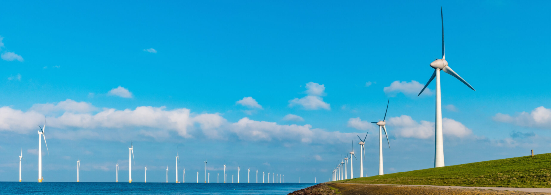 Offshore Windmill farm in the ocean  Westermeerwind park , windmills isolated at sea on a beautiful bright day Netherlands Flevoland Noordoostpolder